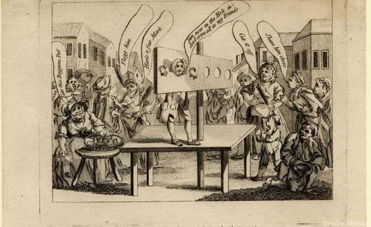 Een homoseksuele man wordt bespot aan de schandpaal