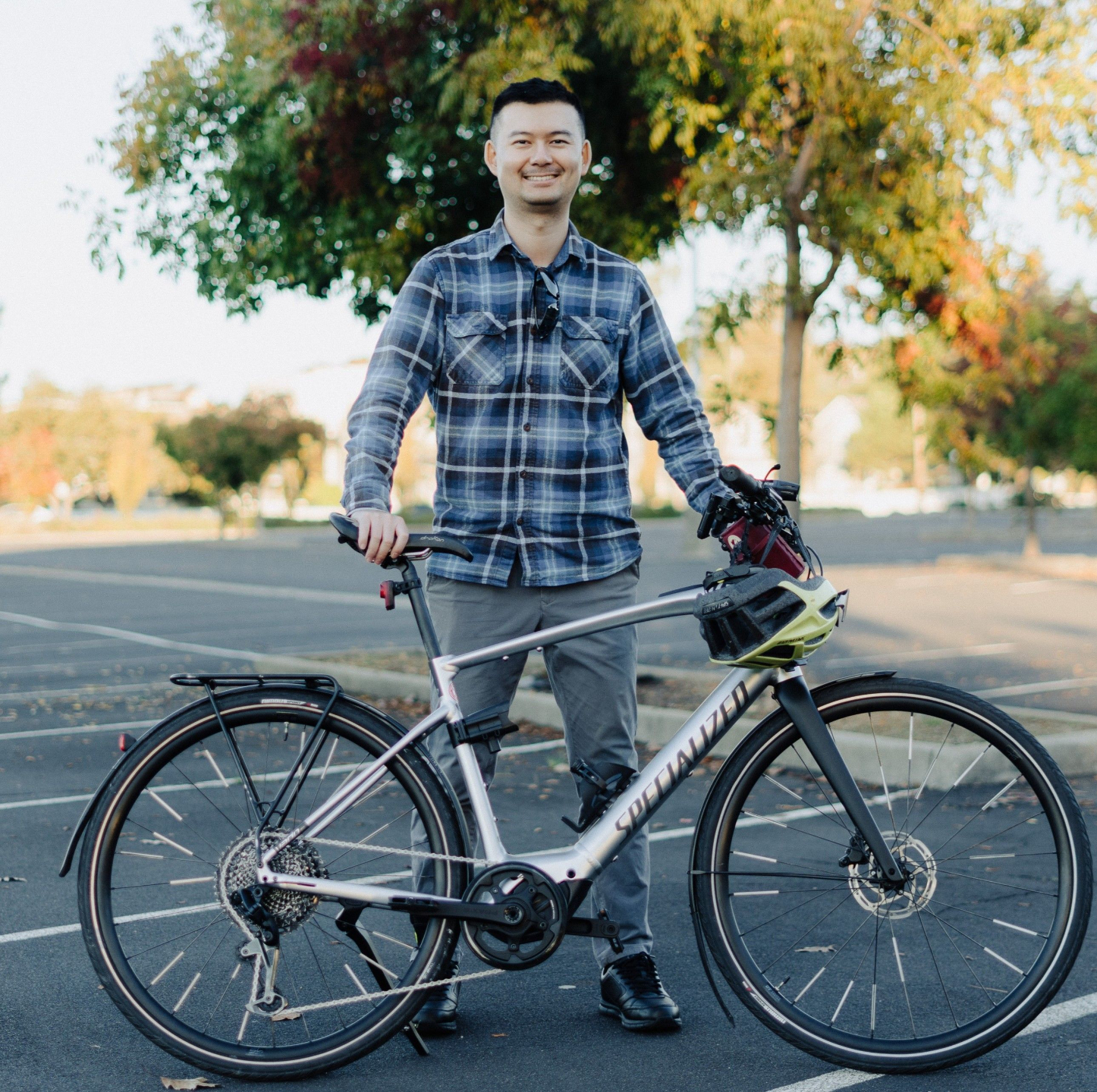 Jianhan Wang standing next to a bicycle