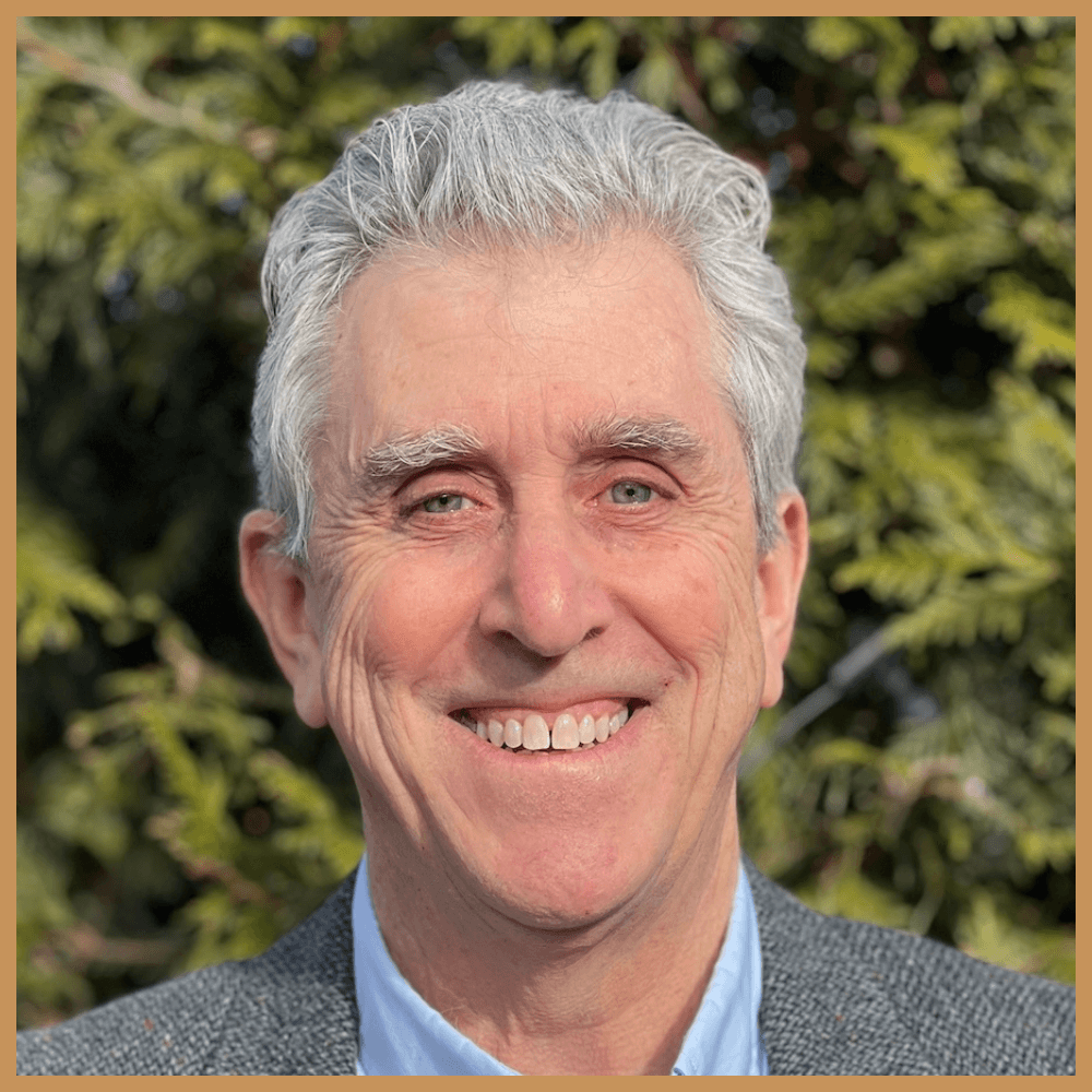 Therapist Crystal Hines standing by a window smiling, promoting her clinical conversation event on ‘Rethinking the IFS Hierarchy’ hosted by the Trauma Therapist Institute.