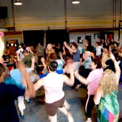 Jim Donovan M.Ed. leading a small wellness drum circle