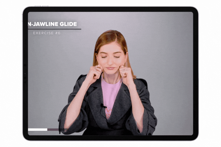 GIF of Valeriia doing massages on her jaw