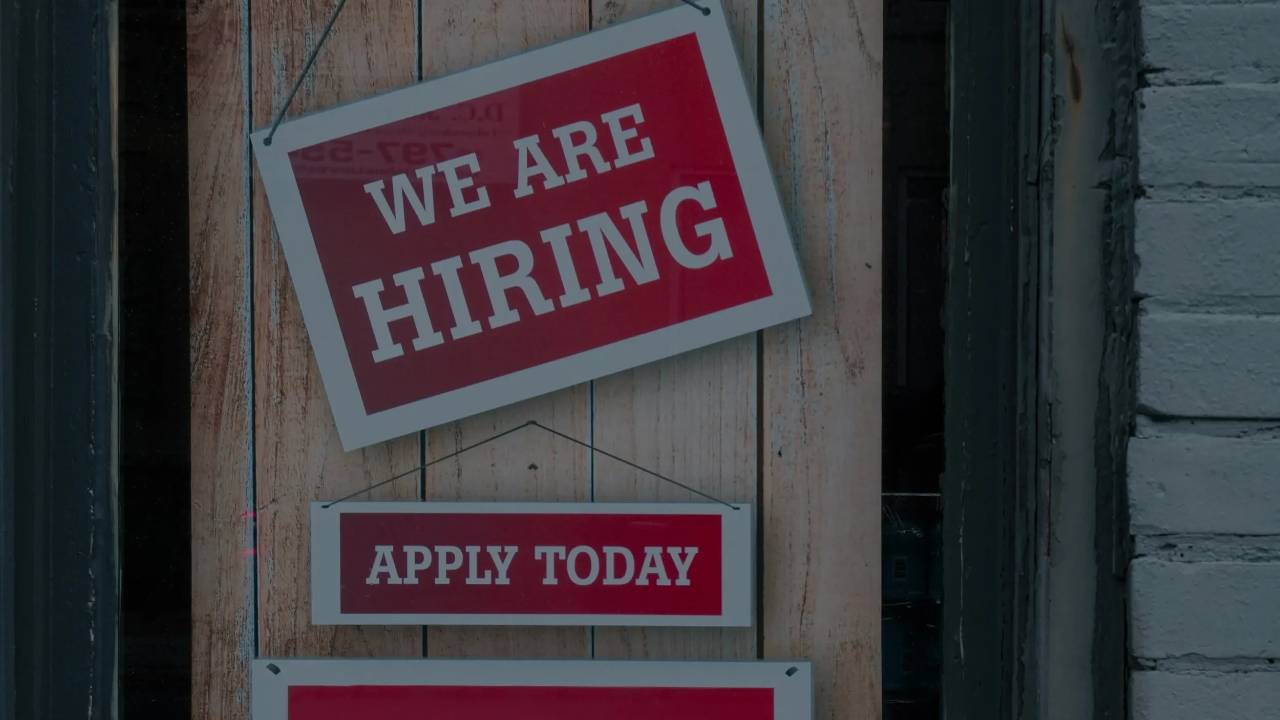 Picture of sign that reads we are hiring