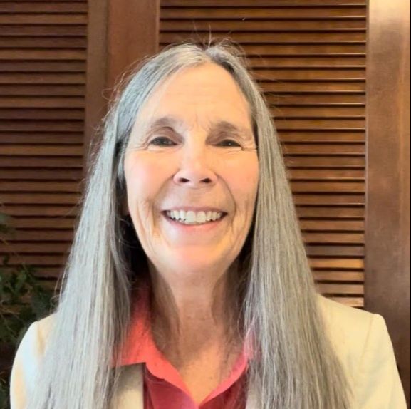 A headshot photo of Maryse Postlewaite