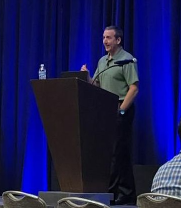 Phil Plisky presenting at the MLB Winter Meetings on performance metrics and professional mastery.