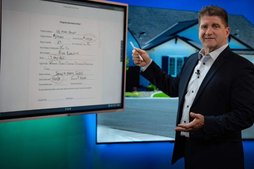 Todd pointing at whiteboard screen.