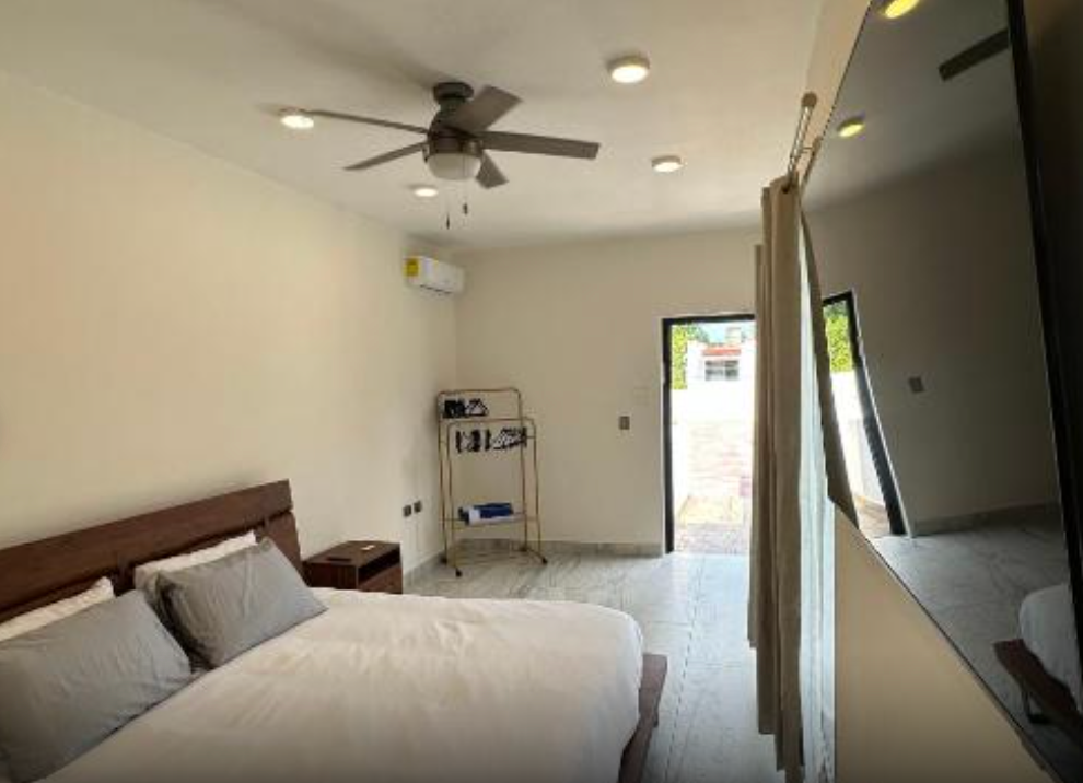 Bedroom with Queen sized bed and large screen TV