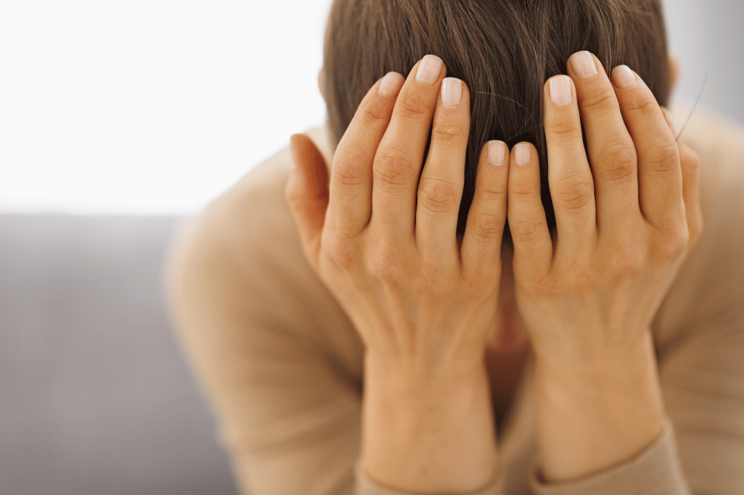 Frustrated women with head in her hands