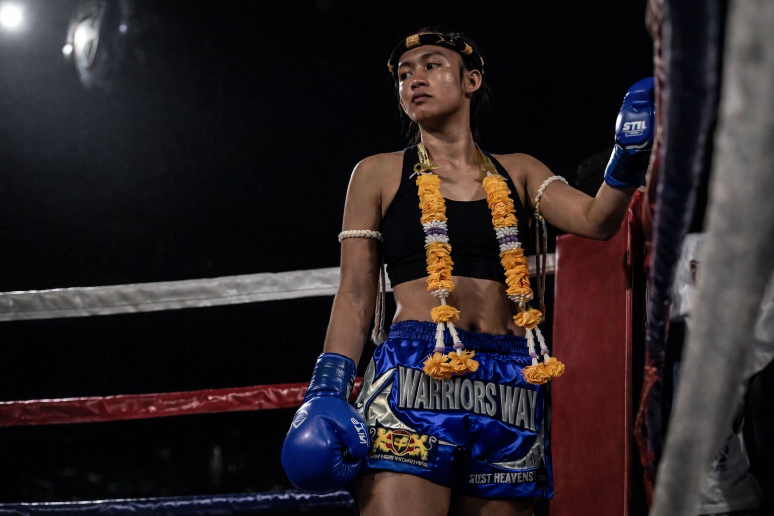 Female muay thai fighter in ring