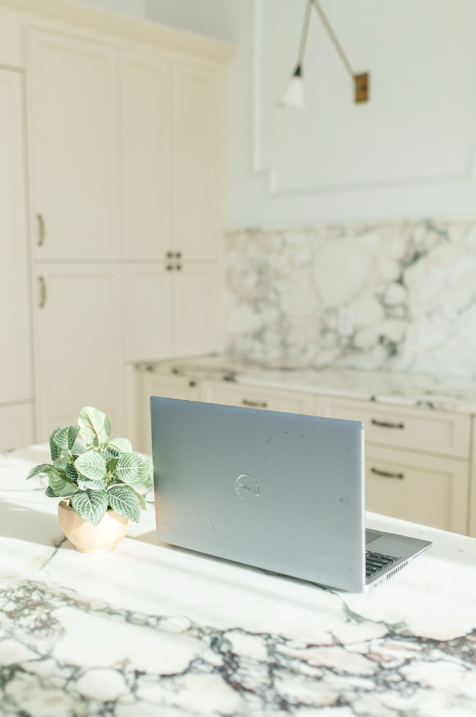 Woman holding a syringe on one hand and a vial on another