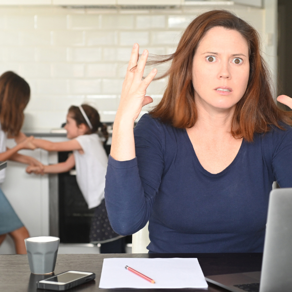 Overwhelmed parent managing a chaotic household
