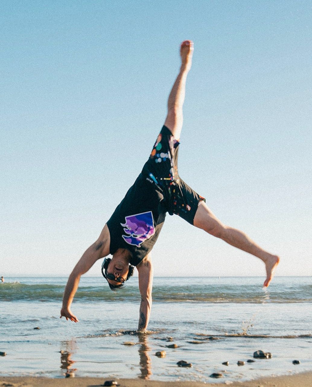 Matt of Upright Health demonstrating shoulder mobility and strength with a beach cartwheel