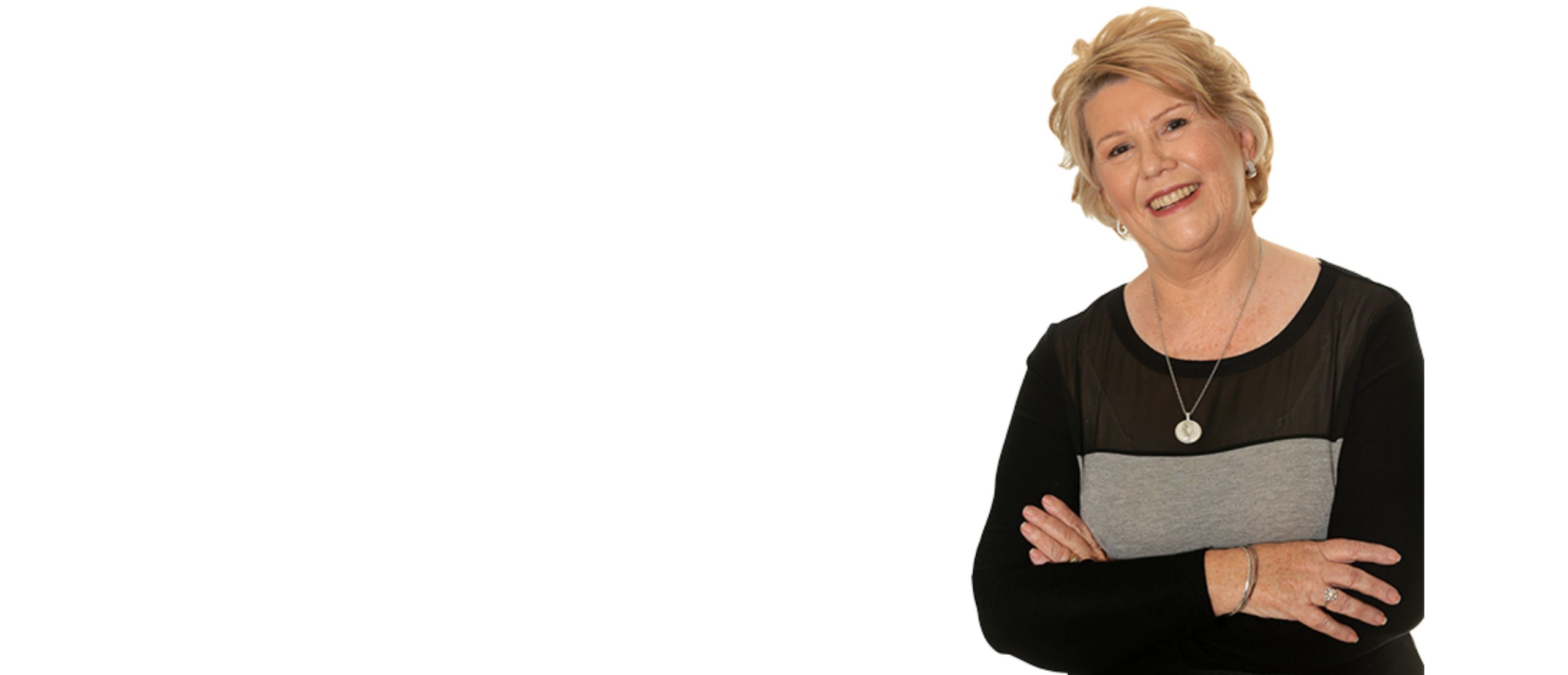 Mother breastfeeding her baby on couch snuggling toddler