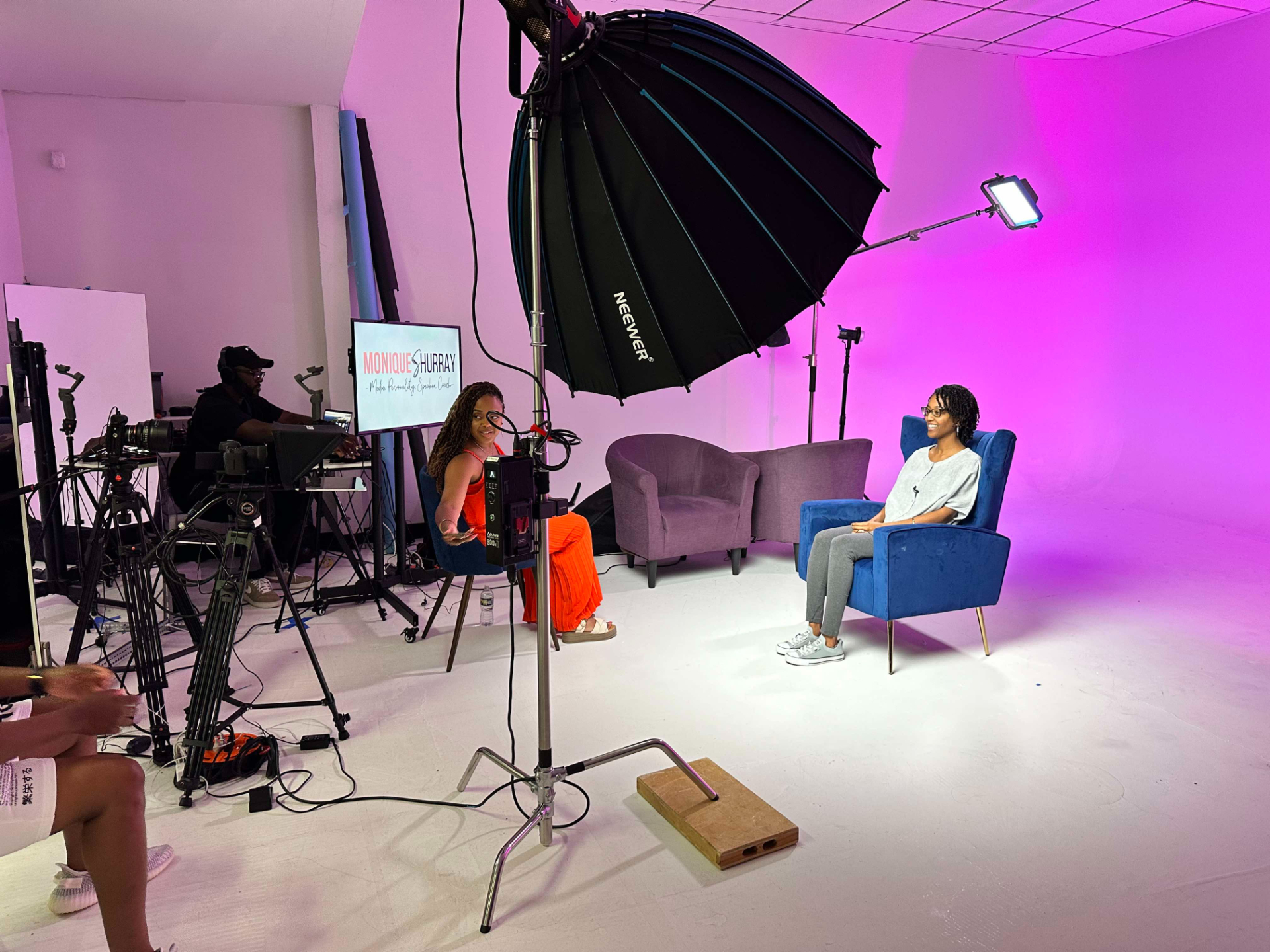Monique coaching in studio with professional lighting