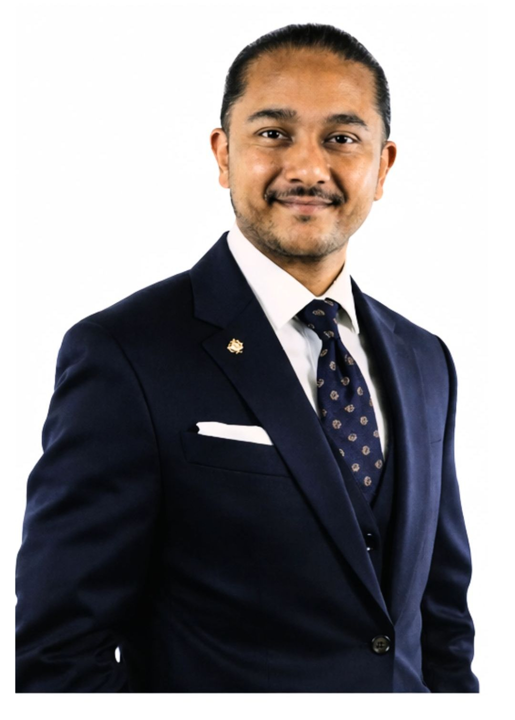 Professional portrait of the DockRoach founder in a navy suit, representing founder-led AMC Clinical exam preparation for international medical graduates in Australia.