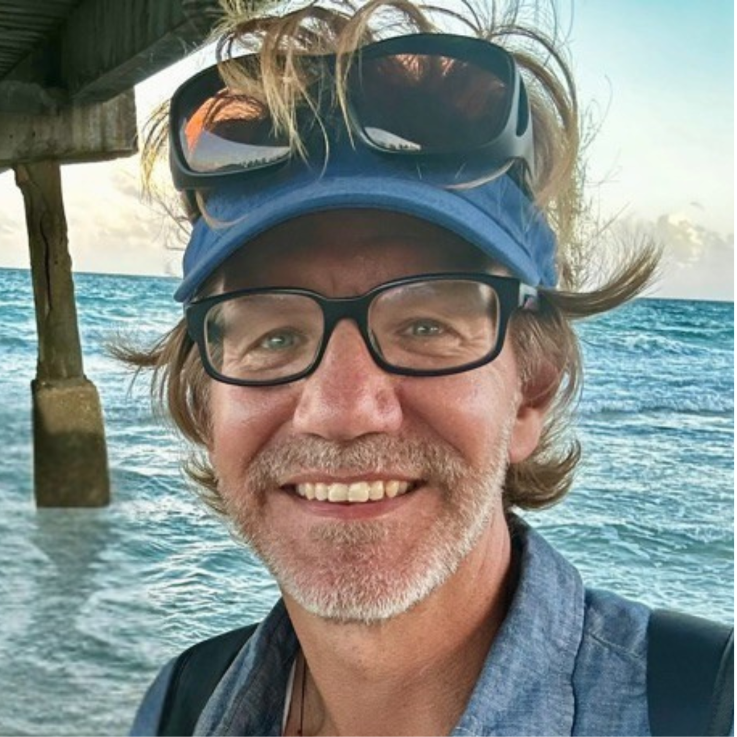 Picture of Erik Orton under a pier by the ocean