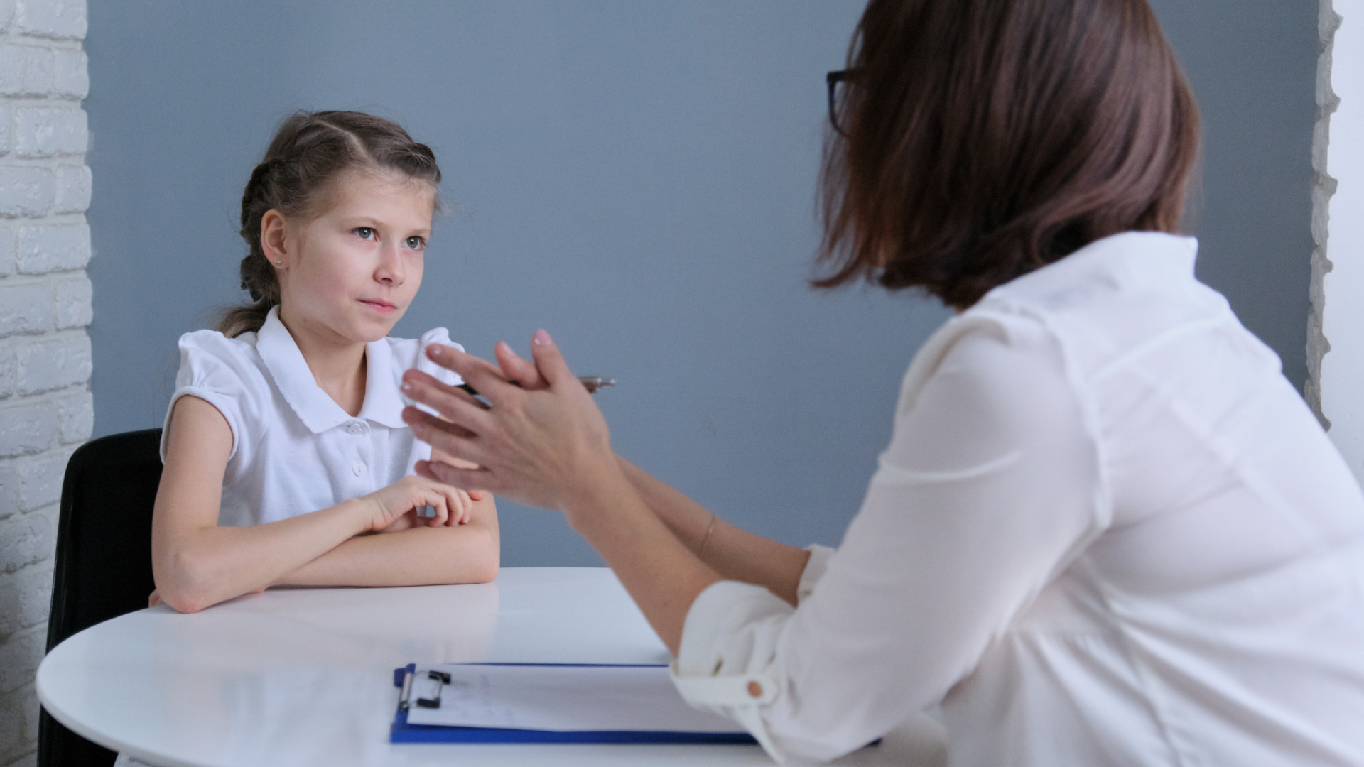Toddler reading a book at Walky Talky Therapy Hub in Perth, supporting early literacy, speech and language development through play-based therapy