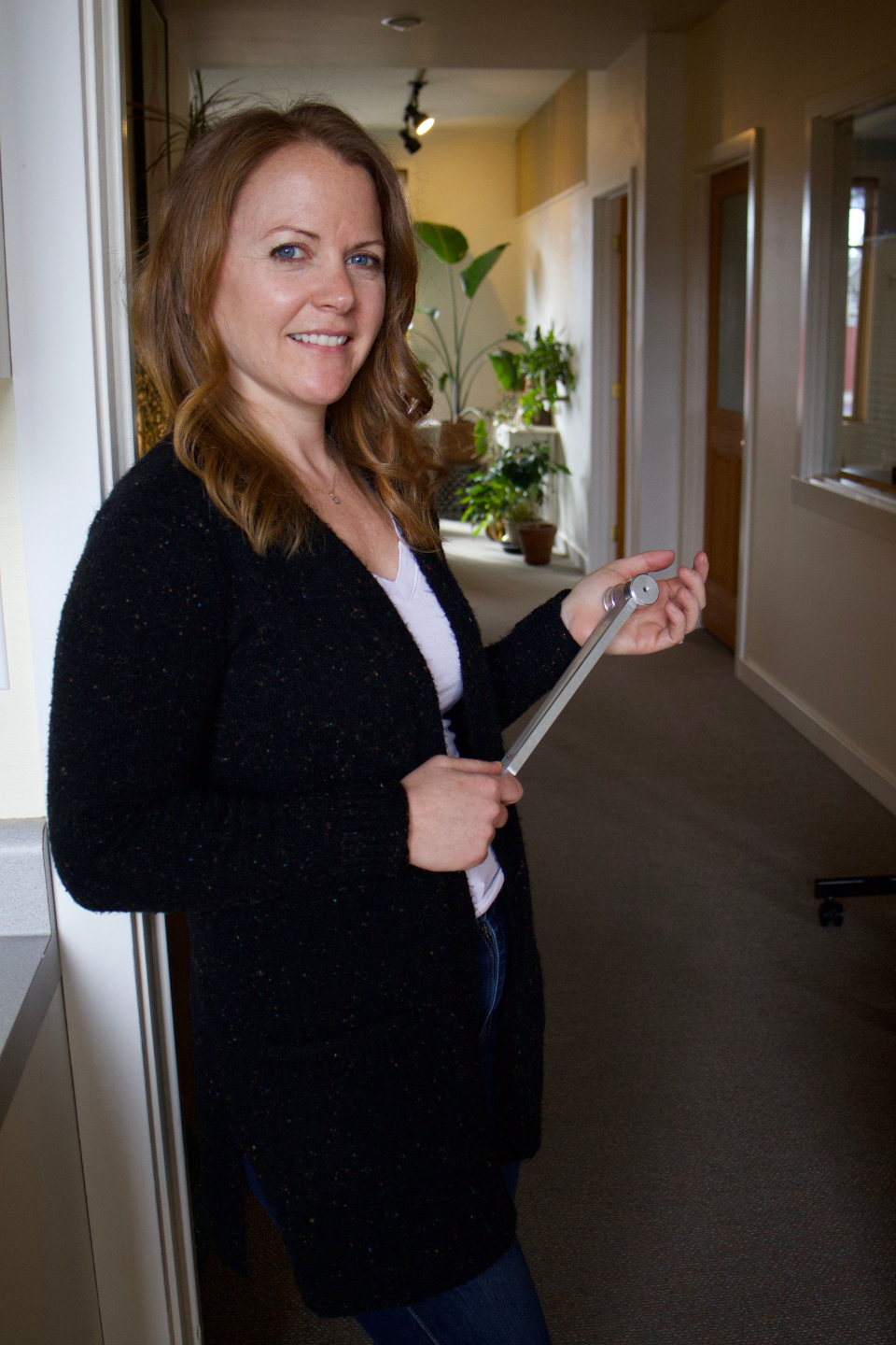 Jillian Faldmo holding tuning fork