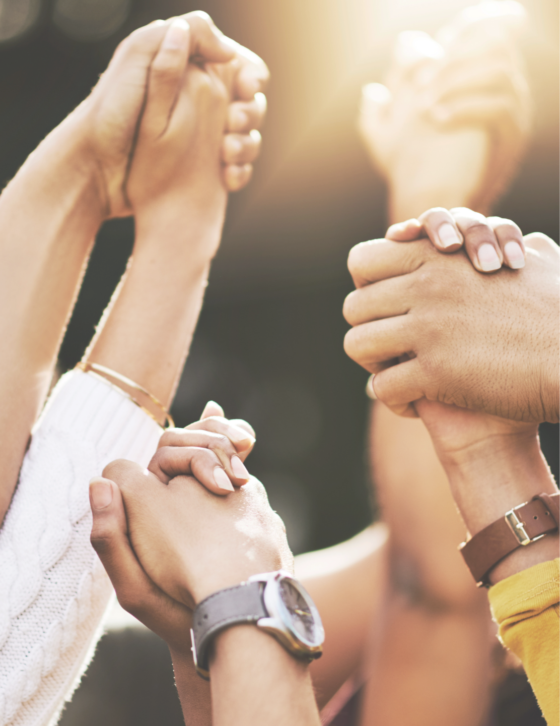 people holding hands and offering support