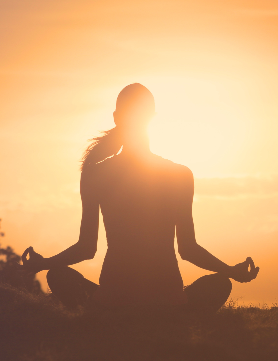 woman sitting in zen position fingertips touching
