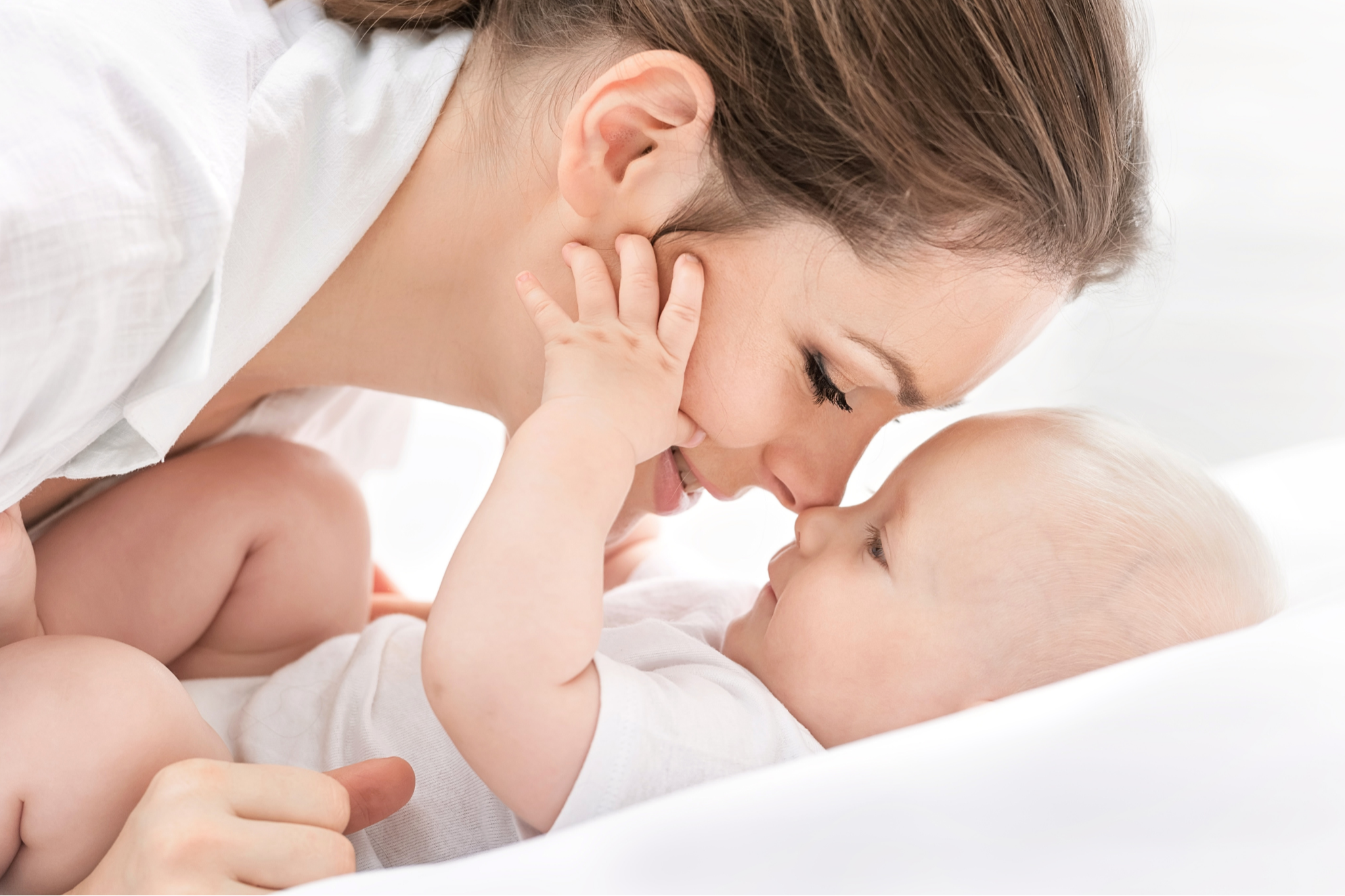 Baby babbling while being held face-to-face with parent at Walky Talky Perth, supporting early language, bonding and speech development.