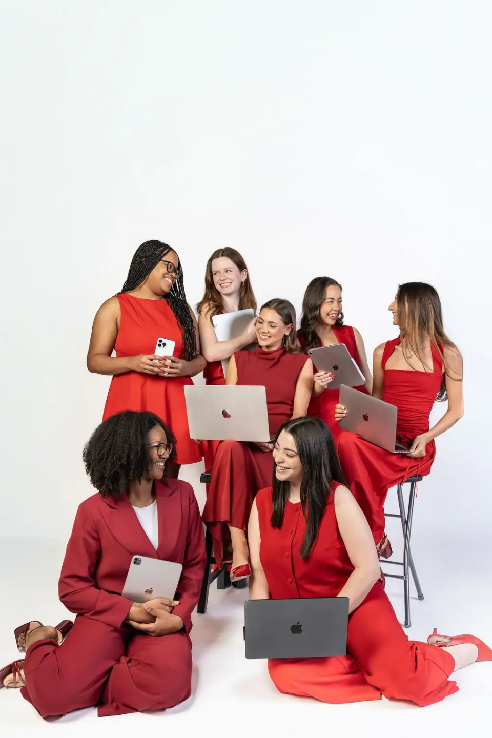 Ninety Five Media team laughing with laptops