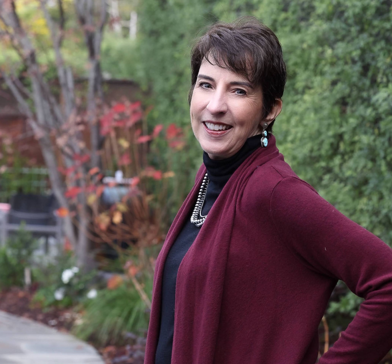 Anne-Rosales-headshot-dark-red-cardigan