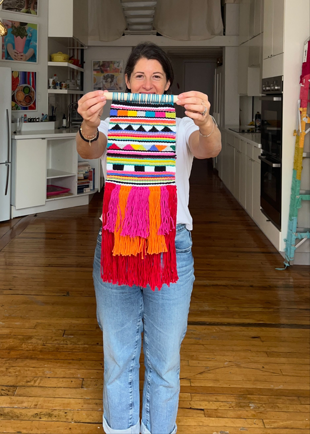 Artist holding Vibrant cotton weaving