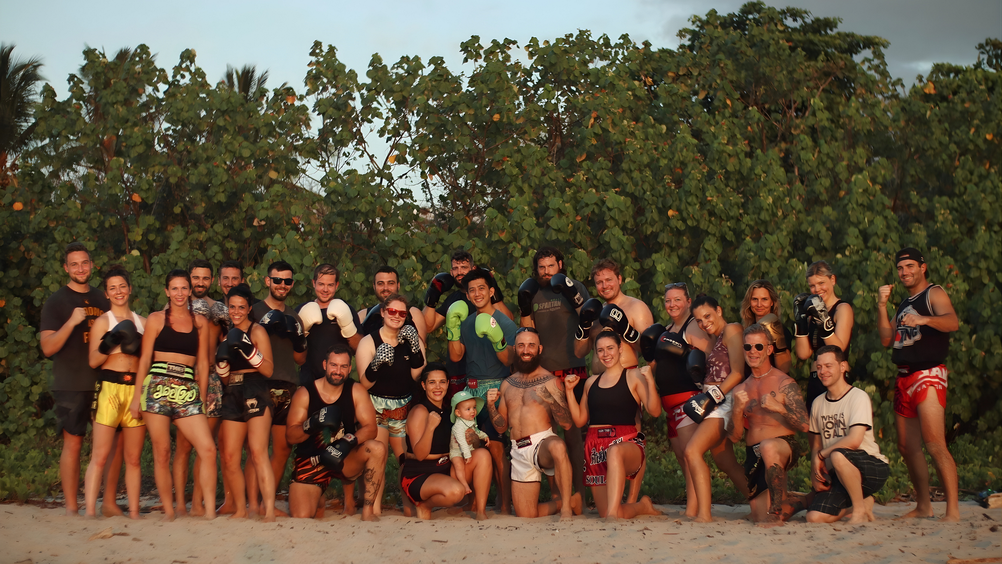A Muay Thai Vacations group on the beach