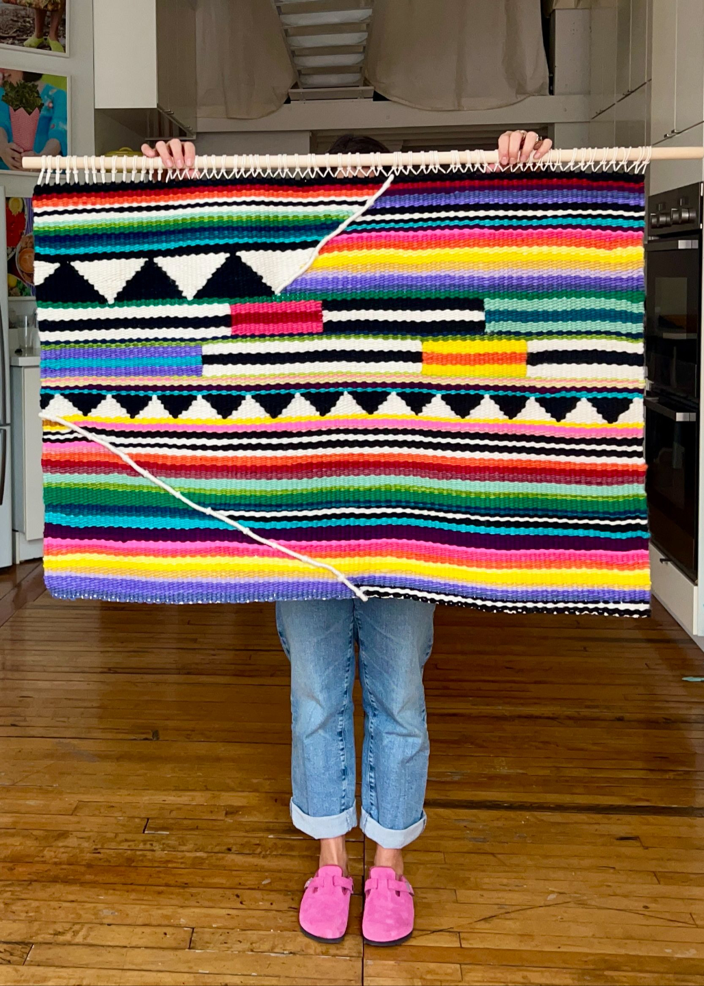Artist holding Vibrant cotton weaving
