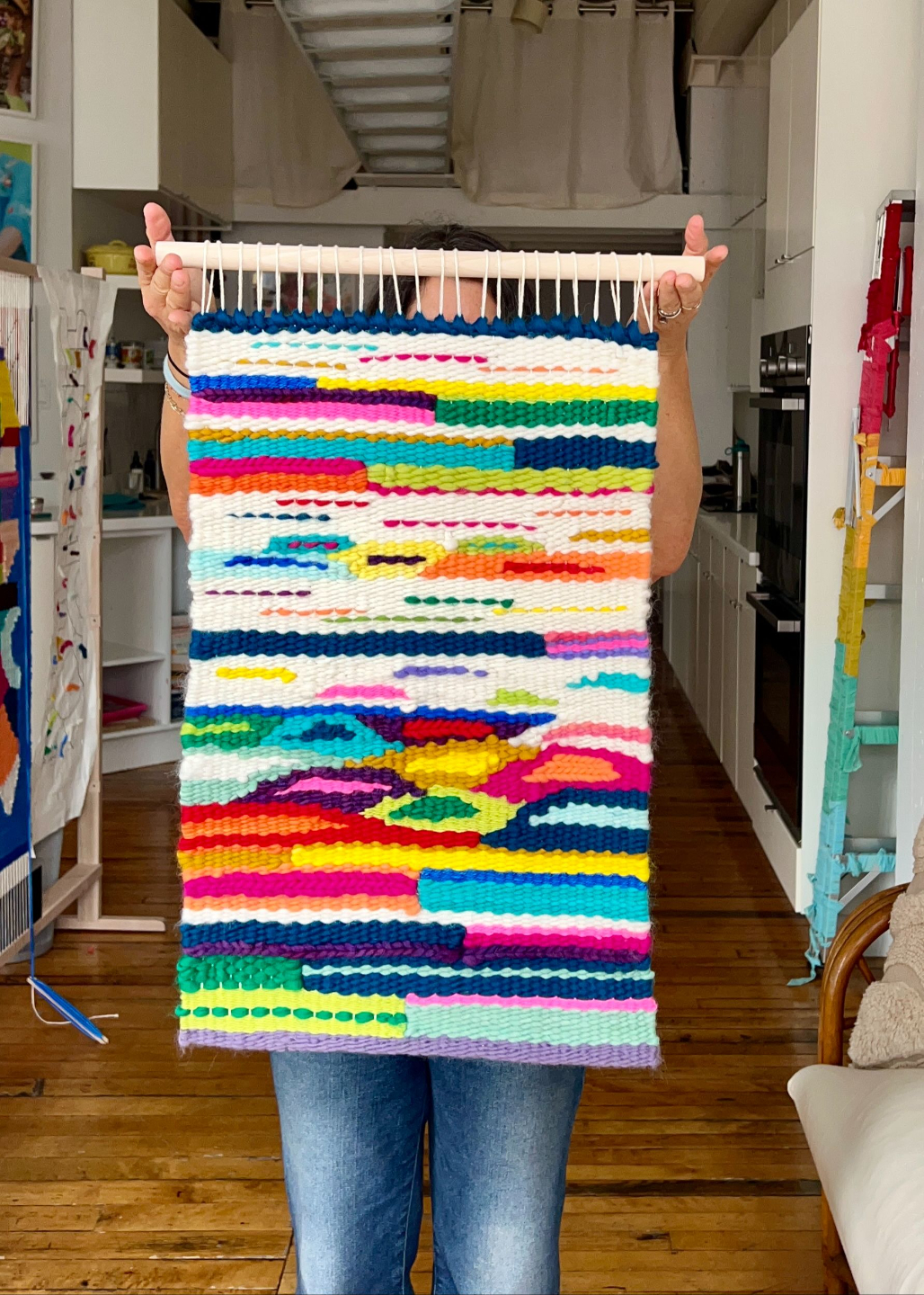 Artist holding Vibrant cotton weaving