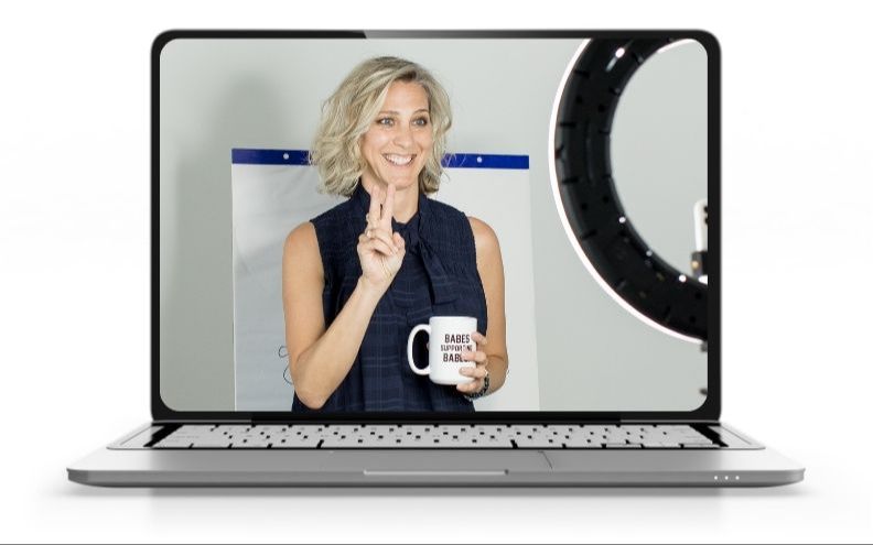 Laptop computer with screen showing Ciara Stockeland behind a ring light teaching an online class