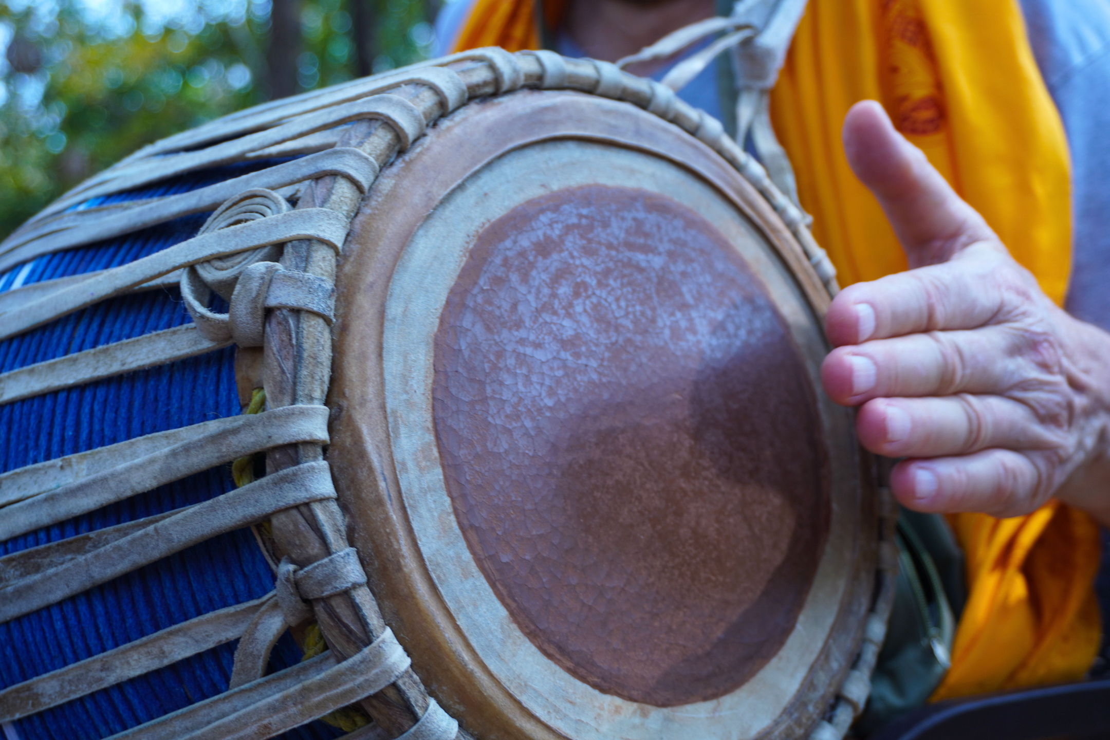 Close-up of a mrdanga drum being played during Mrdanga School training at Govardhan Eco Village in India.