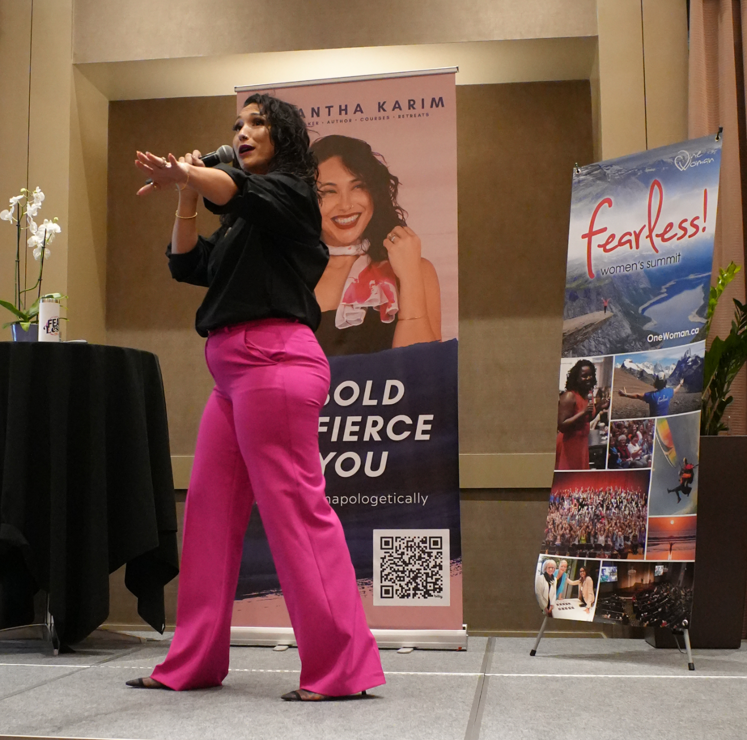 Samantha Karim speaking on stage at the Fearless Women's Summit
