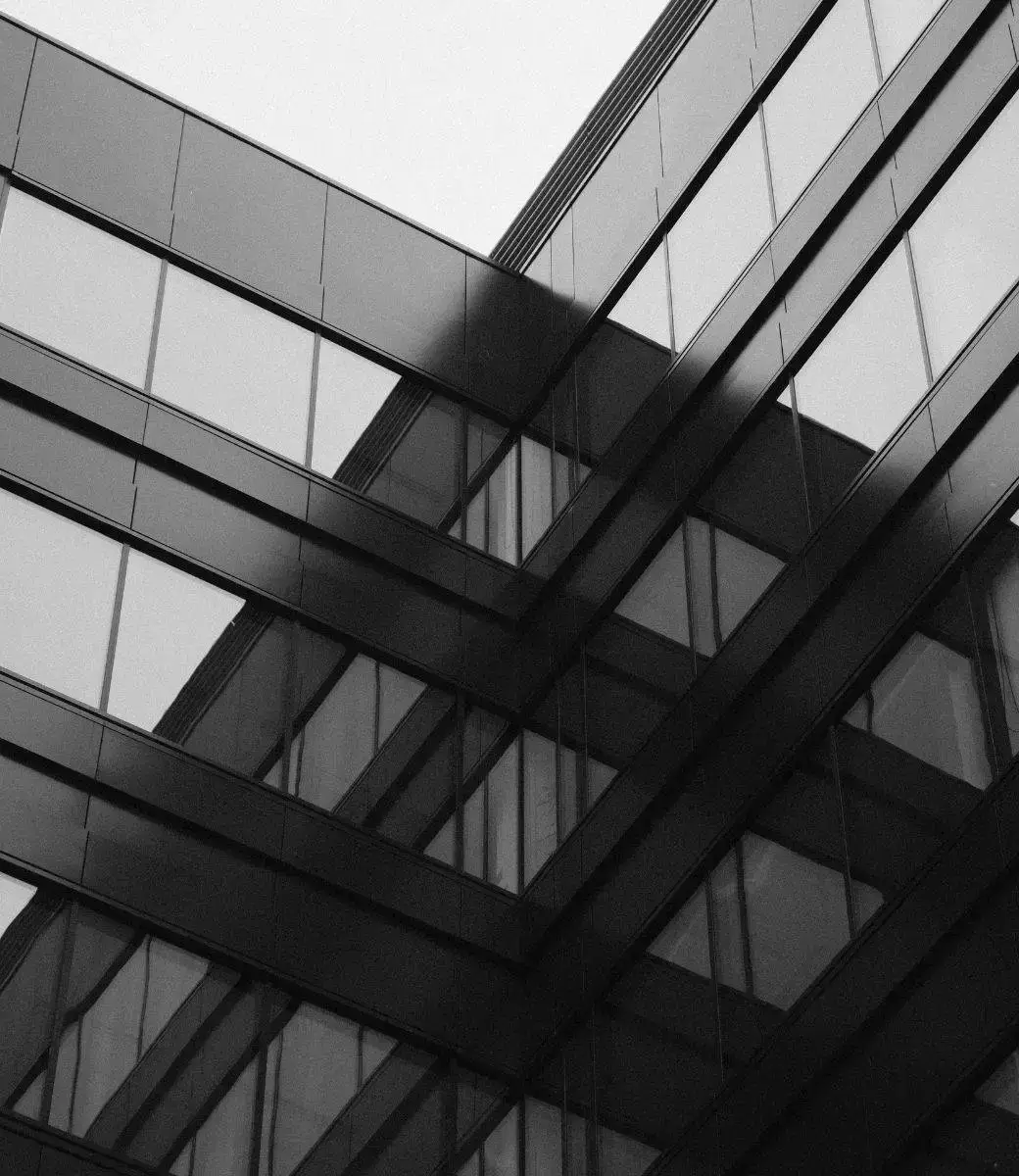 Closeup view of structure and windows of a modern office building.