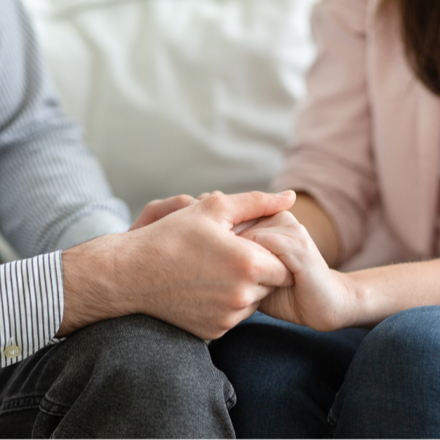 Couple holding hands in Couples Therapy