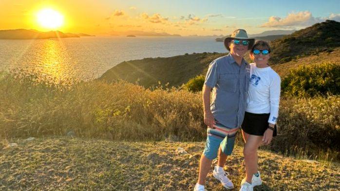 A happy couple hiking on the islands of the British Virgin Islands