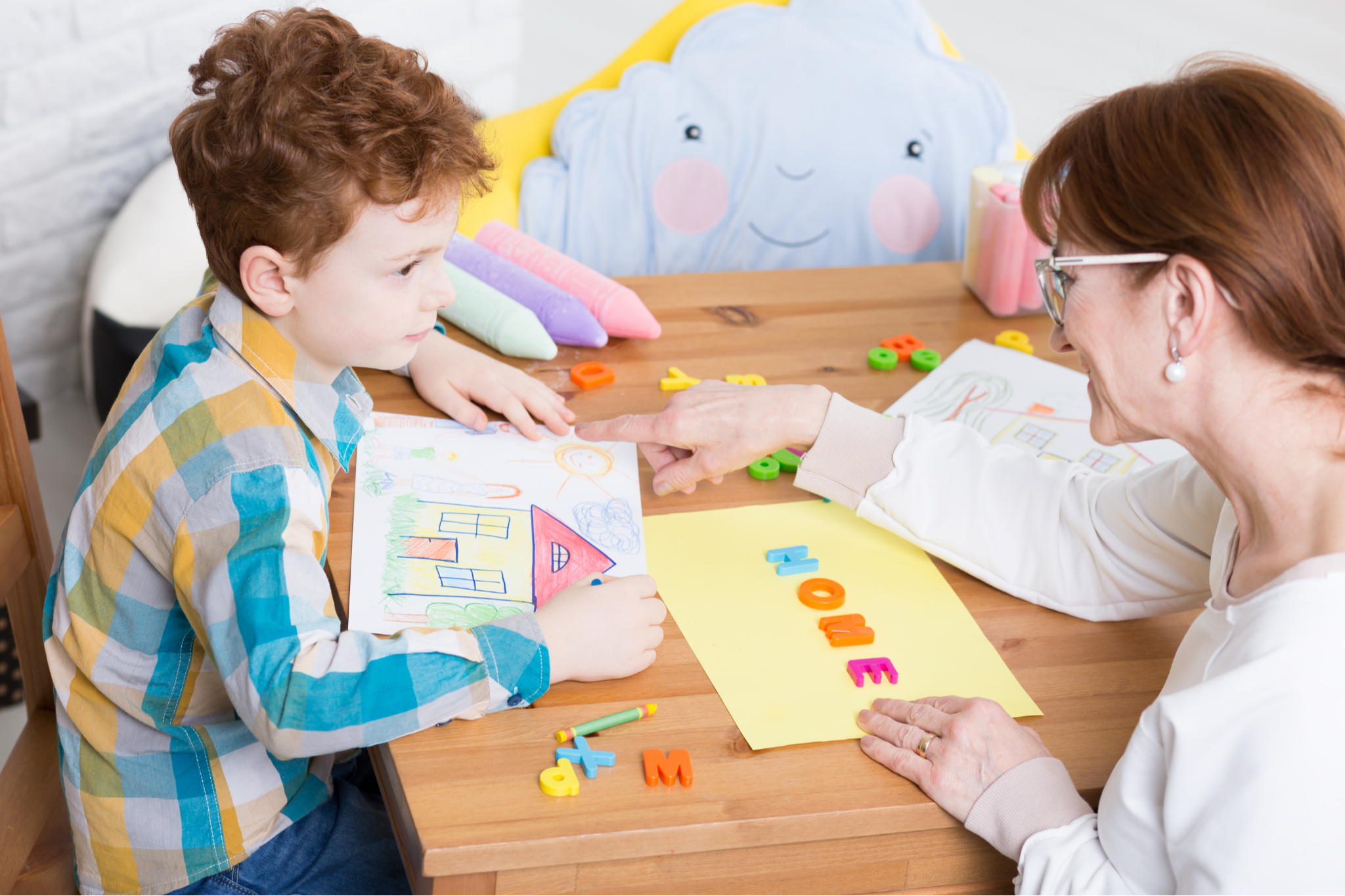 Toddler reading a book at Walky Talky Therapy Hub in Perth, supporting early literacy, speech and language development through play-based therapy