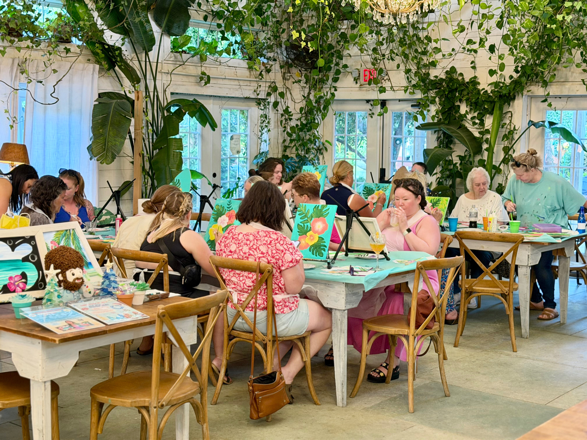 Guests painting together at a Happy Cloud Art Studio event