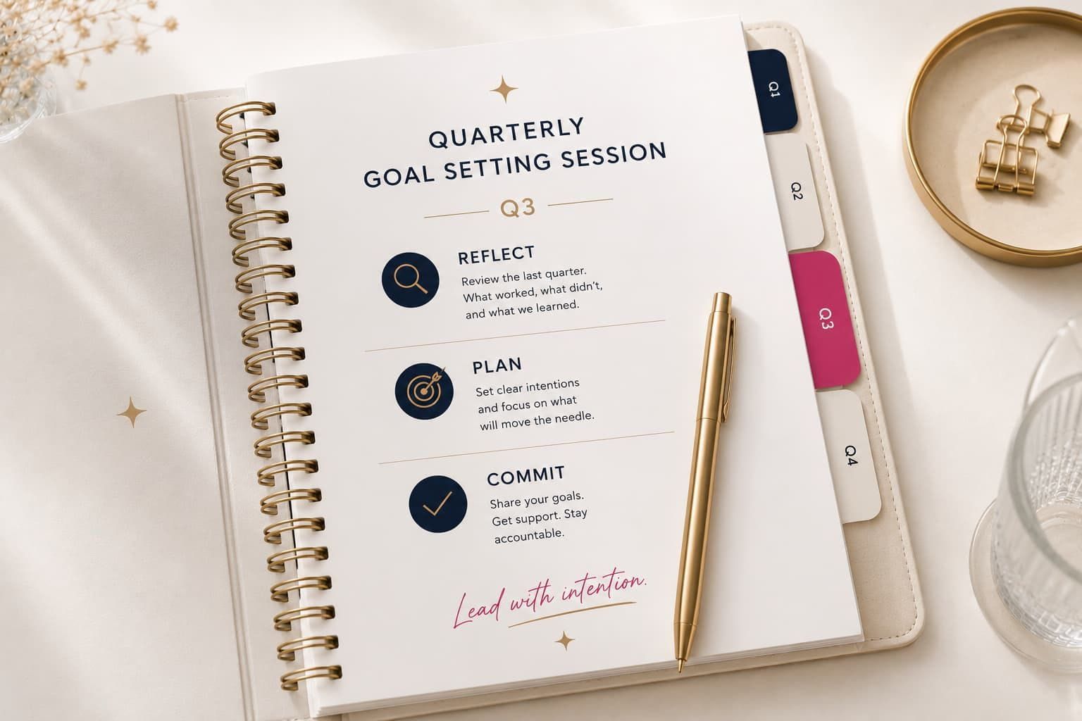 Quarterly goal setting workbook open to the Q3 planning page with a gold pen and tabbed quarterly sections.