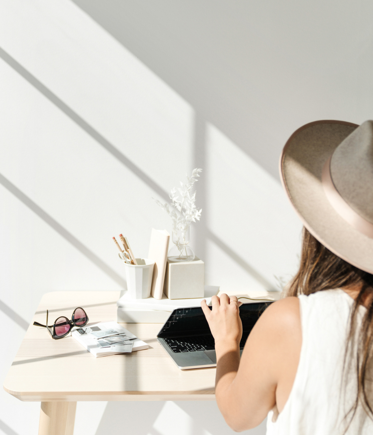 woman opening computer on a desk