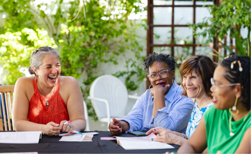 Refer a friend appears under a torn away piece of blue paper. Below that, two young women chat happily