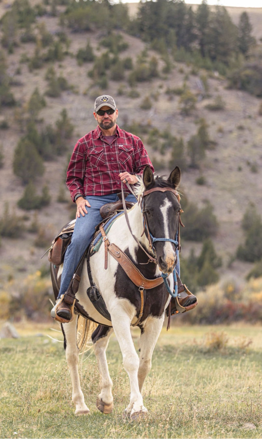 Marcus Truman on horseback in the field