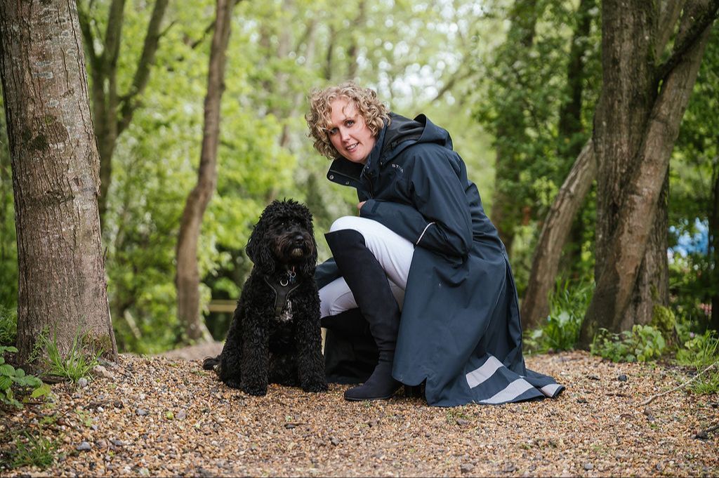 Jenni in the Surrey woodland with her dog