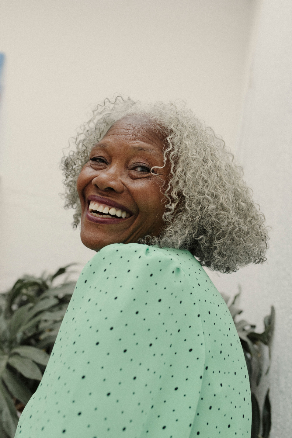 Beautiful older woman smiles joyfully.