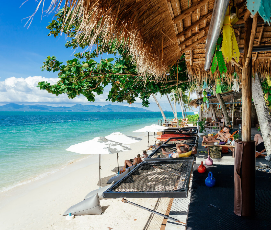 Beachfront loungers and hammocks by the ocean