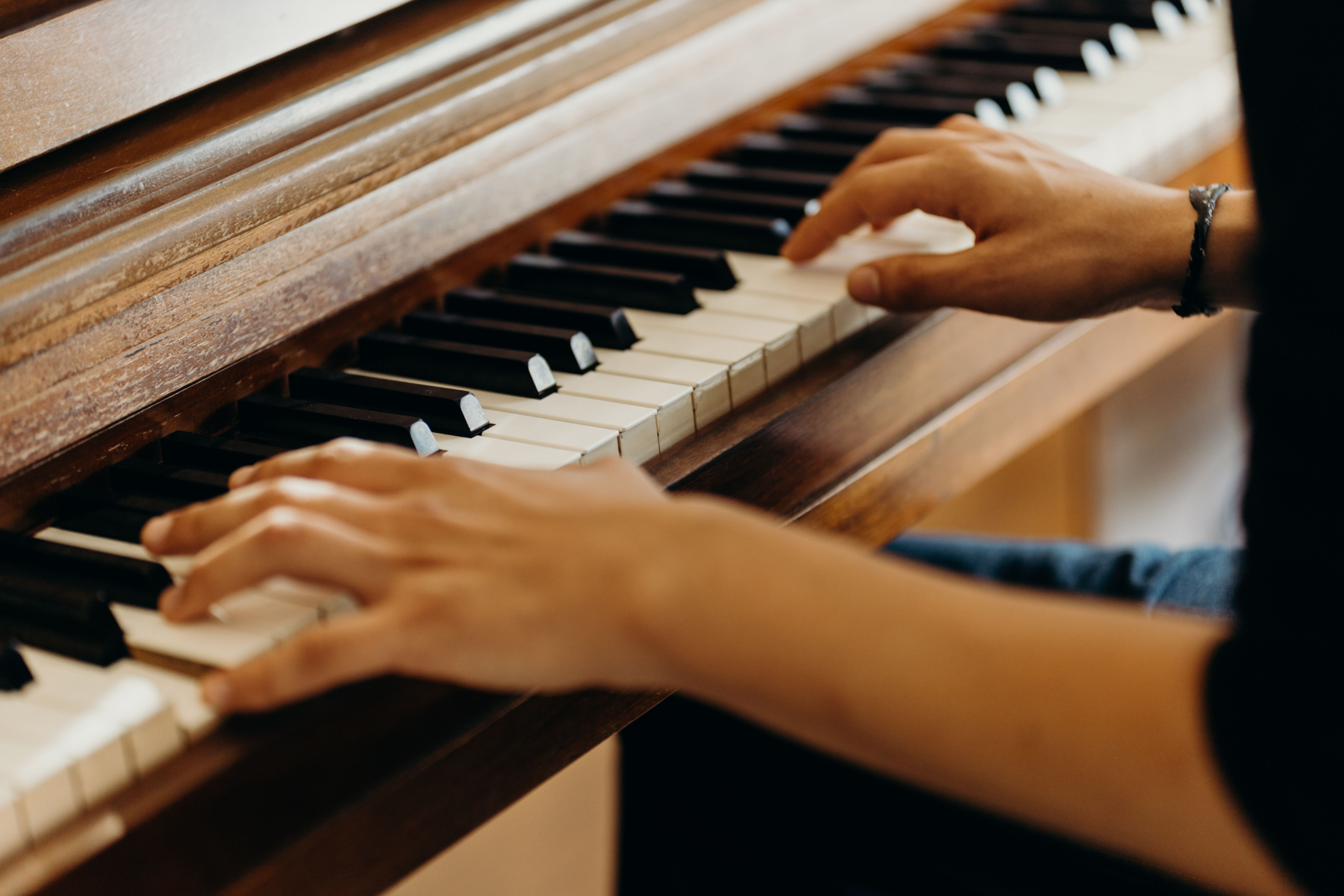 Man plays piano.