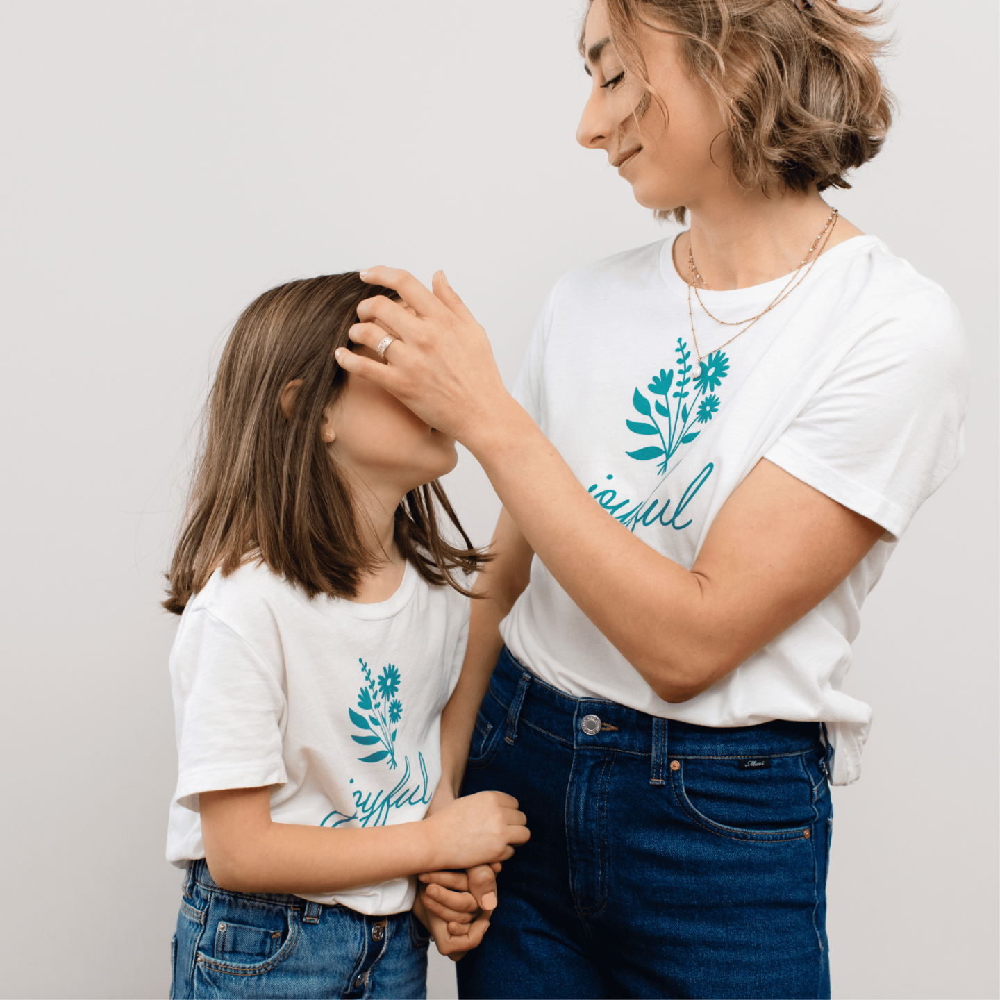 Putting daughter's hair behind ear