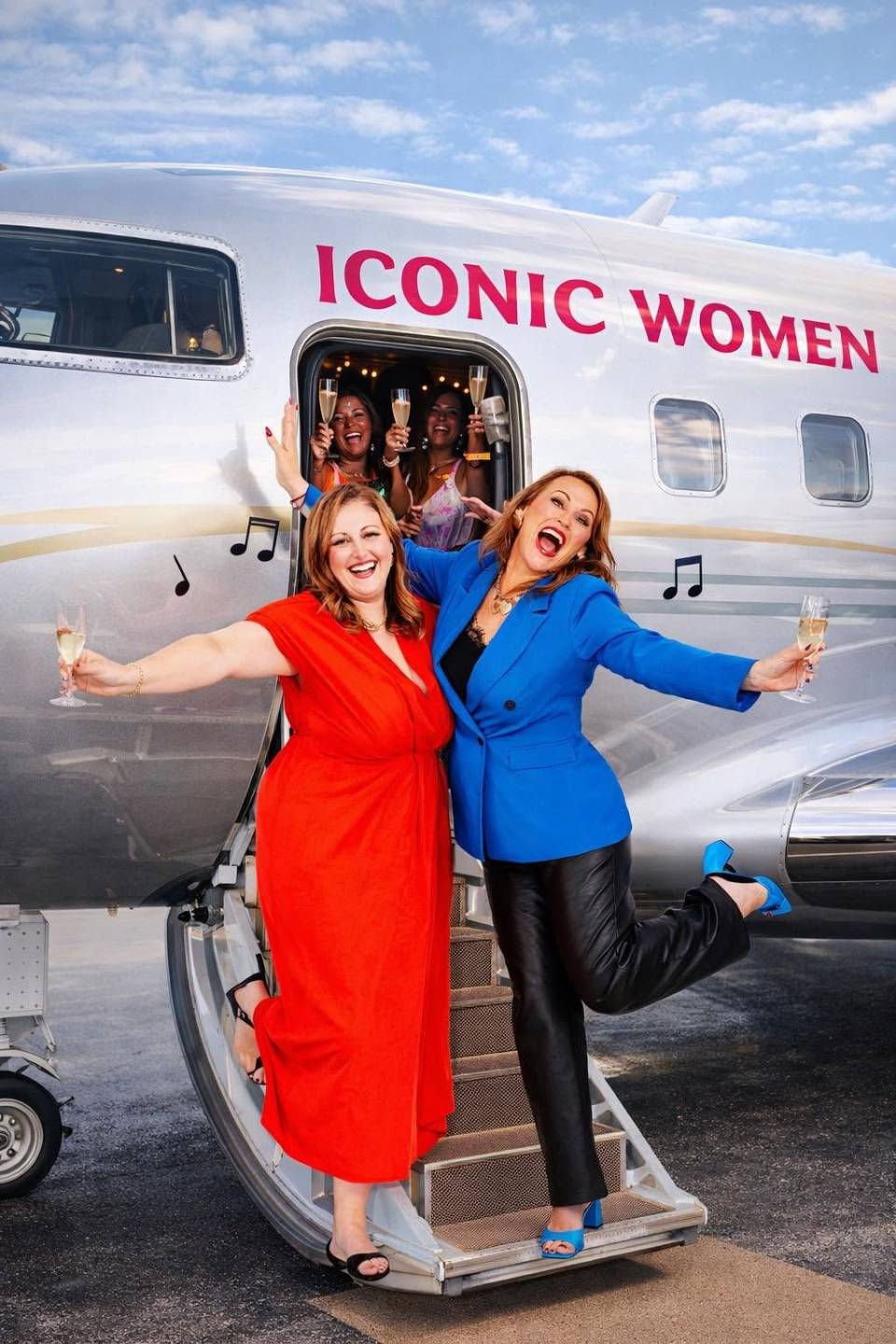 Ali and Danee celebrating beside an Iconic Women jet