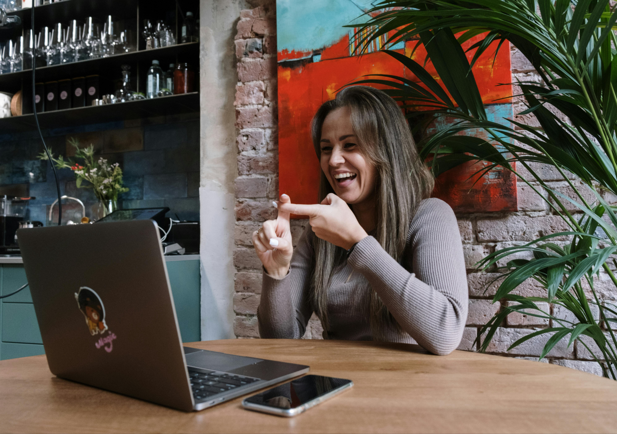 A professional using sign language during a video call