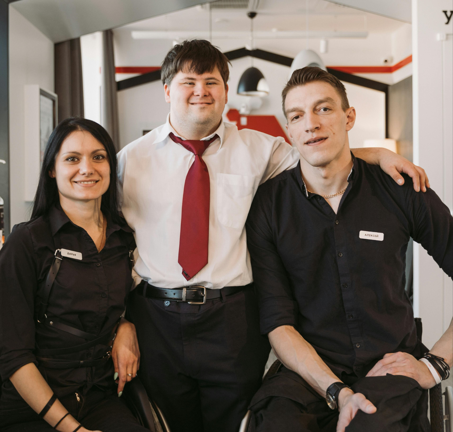 A diverse team including wheelchair users together in an office